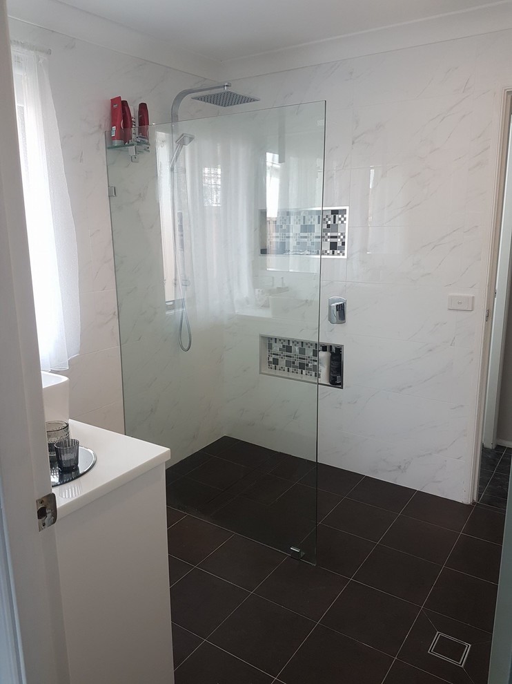 Photo of a contemporary bathroom in Sydney with white walls and porcelain flooring.