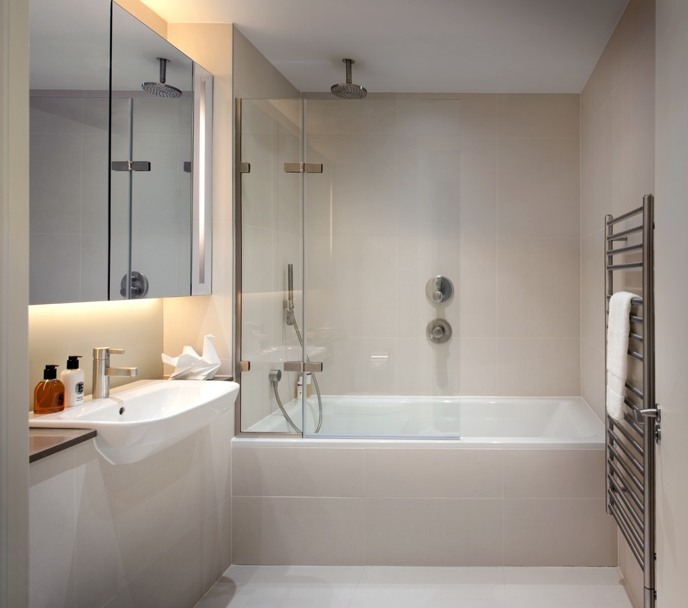 Inspiration for a small contemporary beige tile and ceramic tile ceramic tile and beige floor bathroom remodel in London with a drop-in sink and beige walls