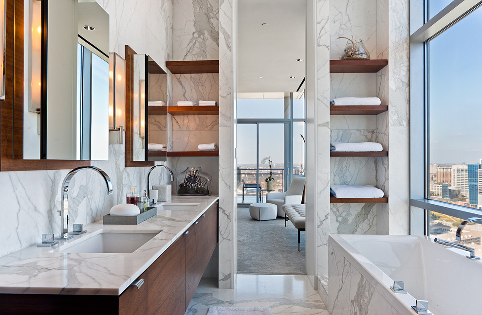 Contemporary bathroom in Dallas with marble worktops and marble tiles.
