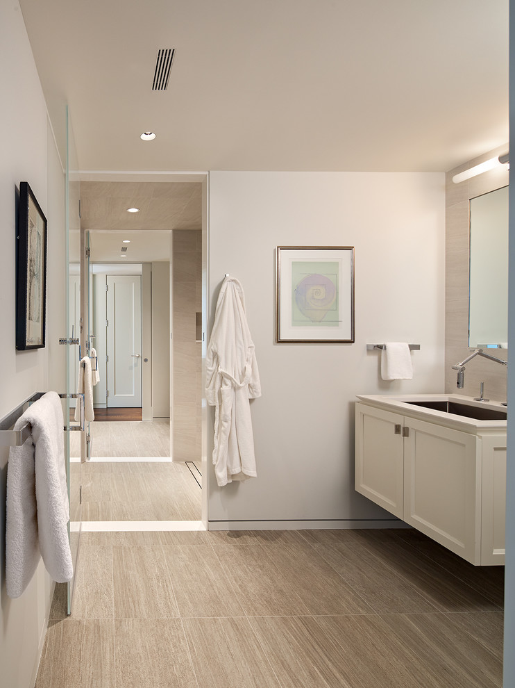 Inspiration for a medium sized modern ensuite bathroom in DC Metro with recessed-panel cabinets, white cabinets, light hardwood flooring, a submerged sink, engineered stone worktops and grey walls.