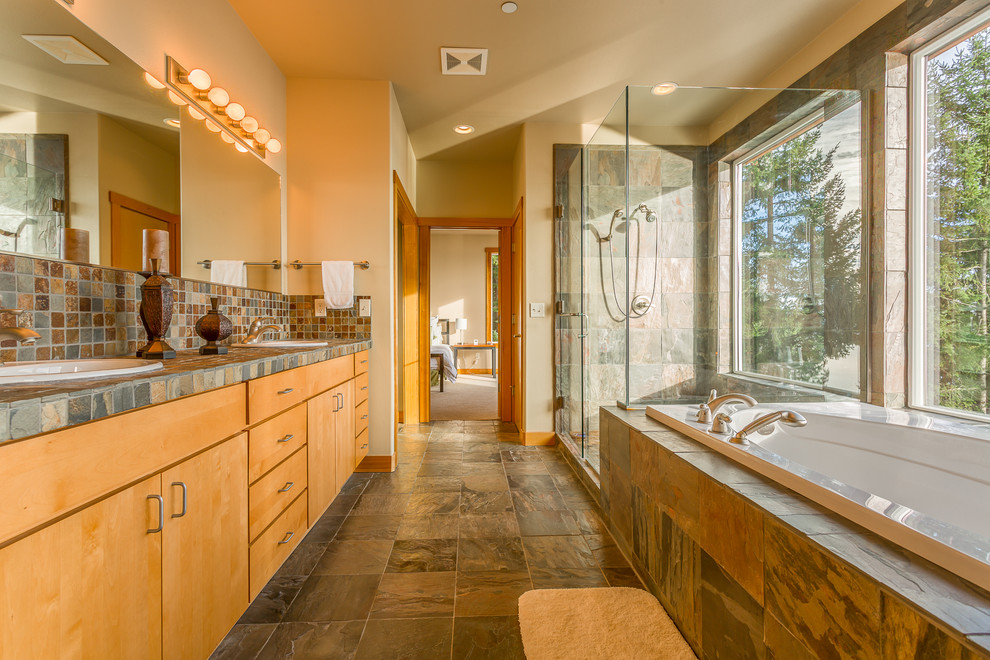 Example of a trendy master multicolored tile and stone tile slate floor bathroom design in Seattle with a drop-in sink, flat-panel cabinets, light wood cabinets, tile countertops and beige walls