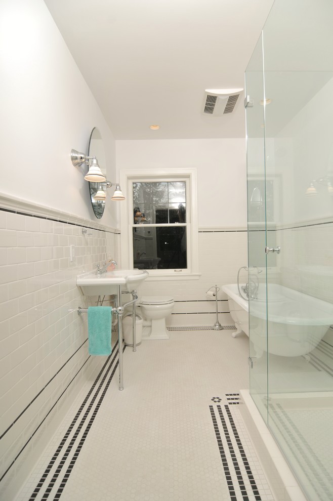 This is an example of a traditional bathroom in Seattle with a claw-foot bath, an alcove shower, white tiles, metro tiles, a pedestal sink, white walls and mosaic tile flooring.