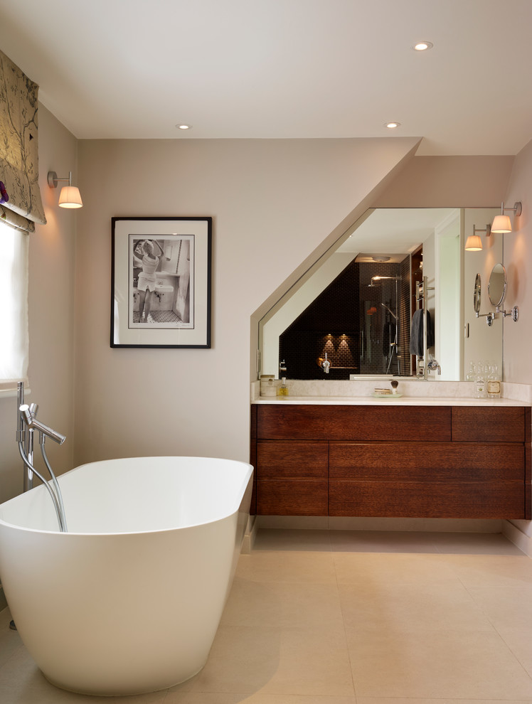 Inspiration for a contemporary travertine floor freestanding bathtub remodel in London with flat-panel cabinets and medium tone wood cabinets