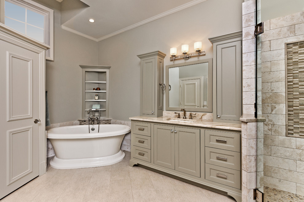 Example of a classic master beige tile and stone tile porcelain tile bathroom design in Dallas with an undermount sink, green cabinets, gray walls, beaded inset cabinets and granite countertops
