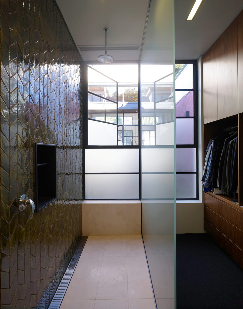 Inspiration for a contemporary brown tile doorless shower remodel in Sydney