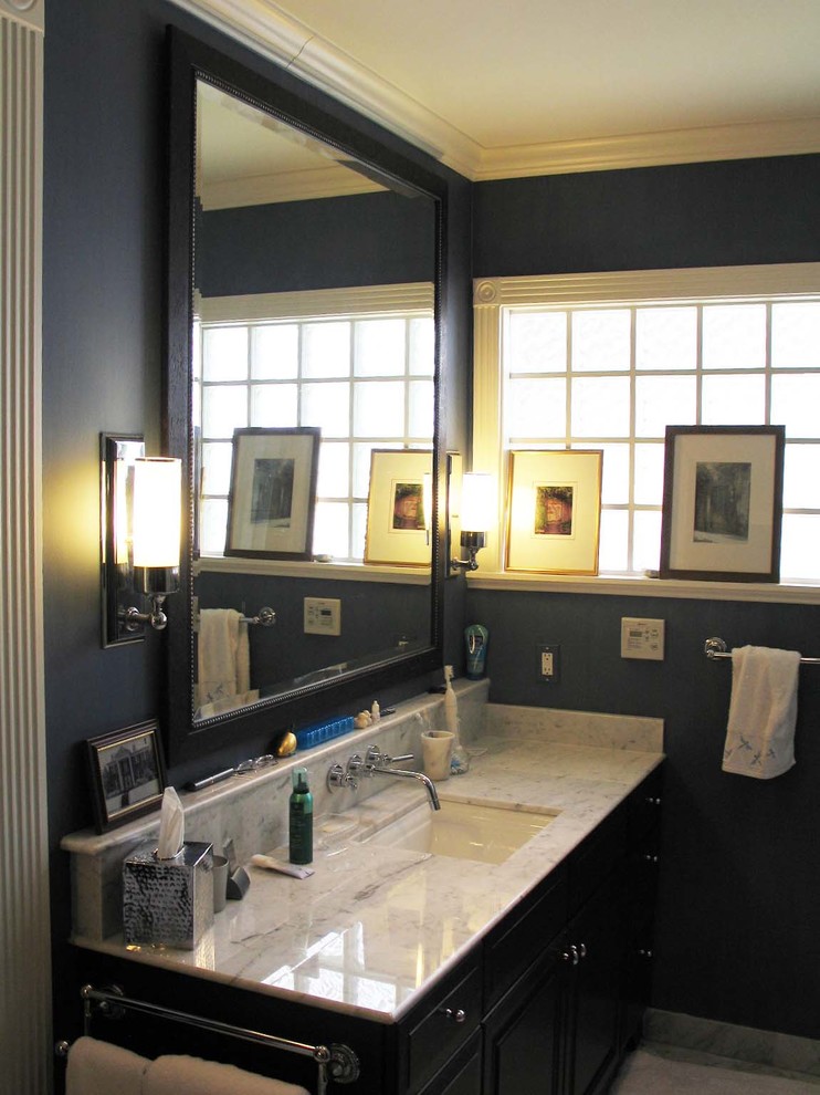Photo of a large classic ensuite bathroom in New Orleans with a submerged sink, dark wood cabinets, granite worktops, a corner shower, blue walls and terracotta flooring.