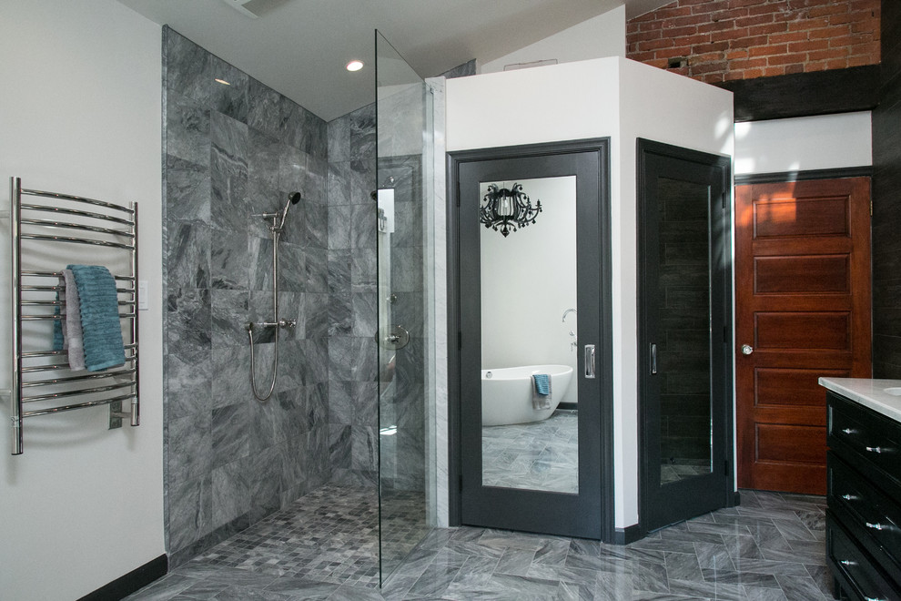 Example of a mid-sized eclectic master gray tile and stone tile marble floor bathroom design in Philadelphia with an undermount sink, recessed-panel cabinets, black cabinets, marble countertops, a wall-mount toilet and white walls