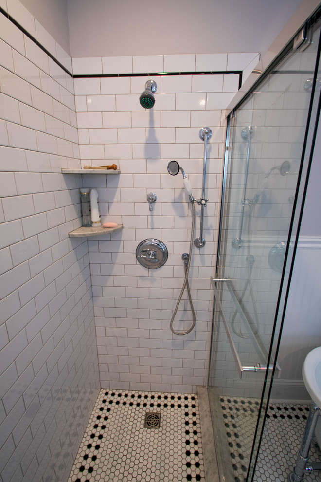 This is an example of a medium sized victorian ensuite bathroom in Philadelphia with recessed-panel cabinets, grey cabinets, a claw-foot bath, a double shower, a two-piece toilet, white tiles, ceramic tiles, grey walls, ceramic flooring, a submerged sink and marble worktops.