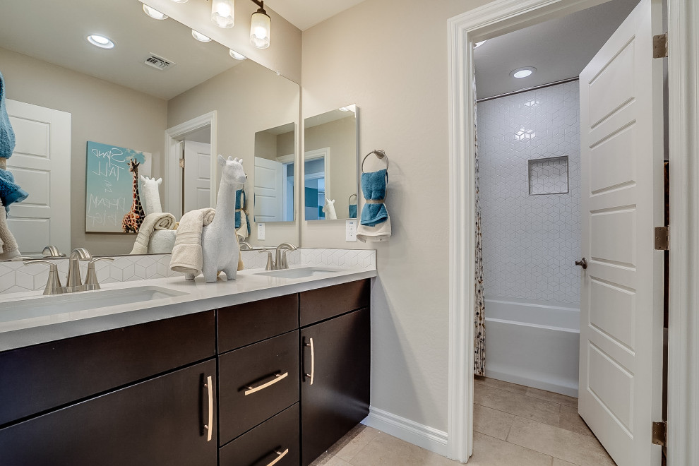 Mid-sized trendy kids' white tile and ceramic tile ceramic tile and beige floor bathroom photo in Phoenix with flat-panel cabinets, beige walls, an undermount sink, solid surface countertops, white countertops and brown cabinets