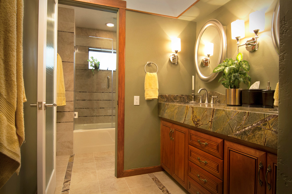 Inspiration for a contemporary stone tile bathroom remodel in Phoenix with raised-panel cabinets, medium tone wood cabinets, marble countertops and green walls