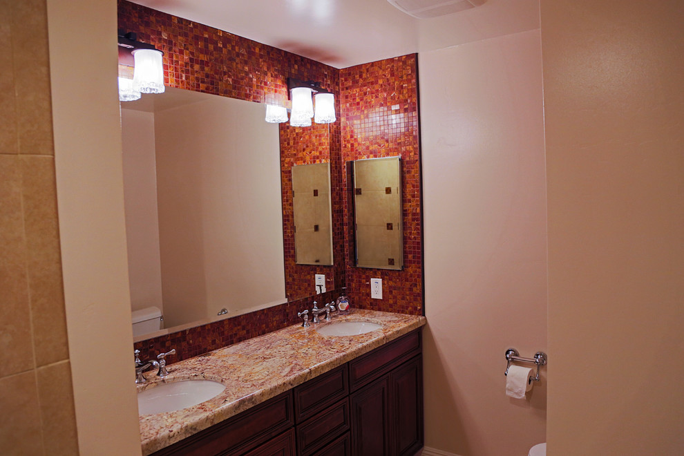 Large elegant master beige tile travertine floor bathroom photo in Phoenix with an undermount sink, dark wood cabinets, granite countertops, a two-piece toilet and beige walls