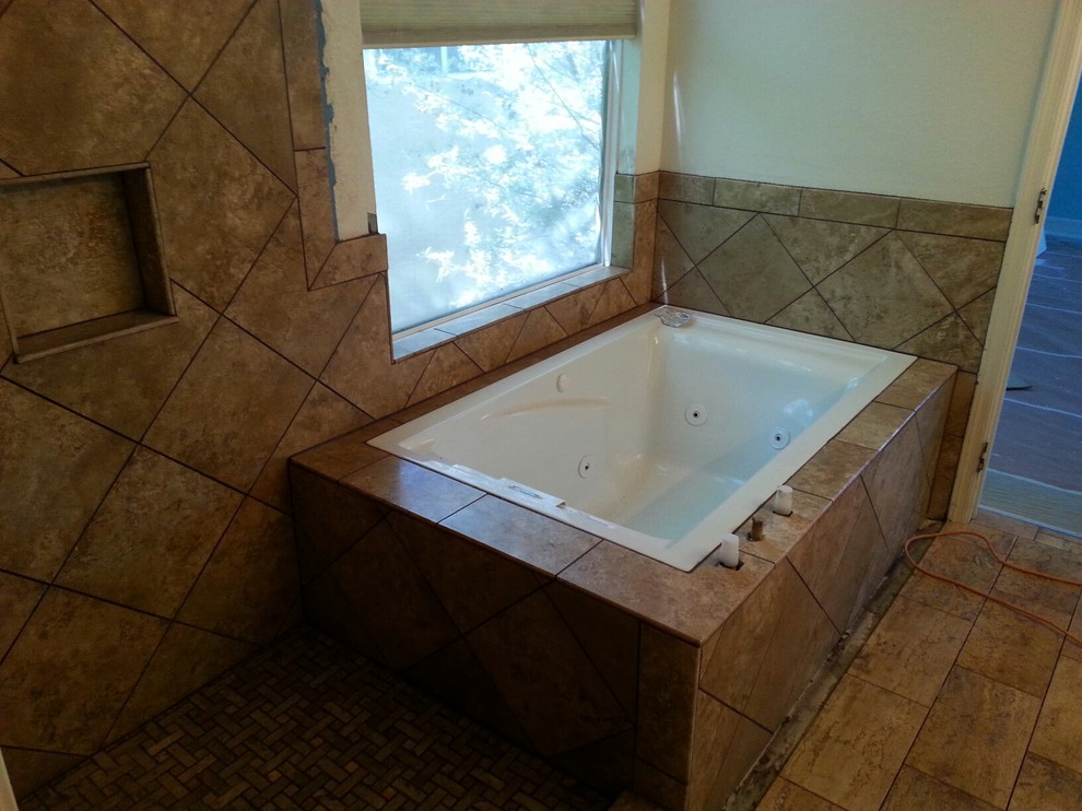 Mid-sized transitional master brown tile and stone tile travertine floor tub/shower combo photo in Phoenix with an undermount sink, open cabinets, beige cabinets, a one-piece toilet and beige walls