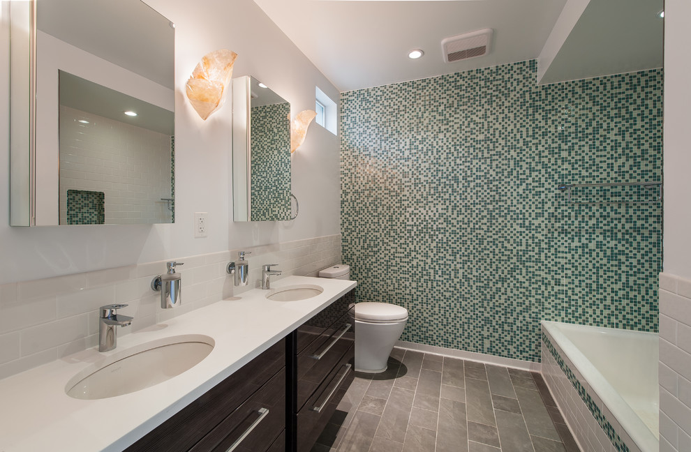 Inspiration for a contemporary multicolored tile and mosaic tile bathroom remodel in New York with an undermount sink, flat-panel cabinets and white walls
