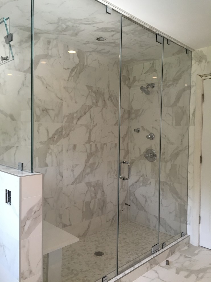 This is an example of a large contemporary bathroom in New York with a corner shower, porcelain tiles and porcelain flooring.