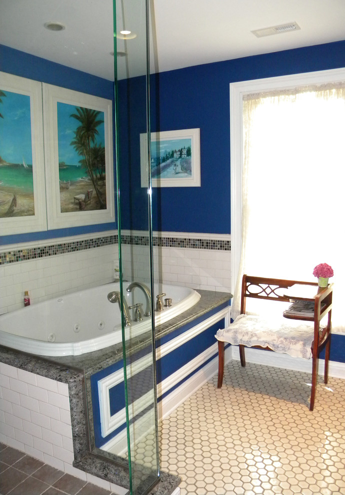 This is an example of a large victorian ensuite bathroom in Chicago with raised-panel cabinets, dark wood cabinets, a corner shower, a two-piece toilet, white tiles, blue walls, mosaic tile flooring, a built-in sink, marble worktops, white floors, a hinged door, a hot tub, mosaic tiles, brown worktops, double sinks, a floating vanity unit, exposed beams and wallpapered walls.