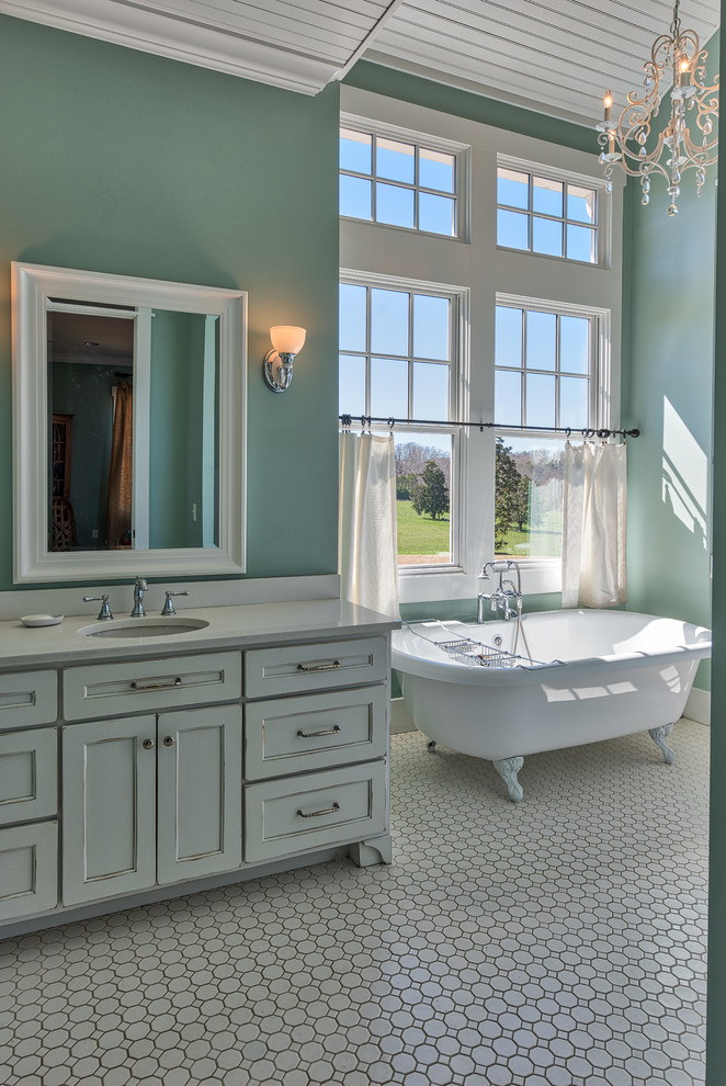Large farmhouse ensuite bathroom in Other with flat-panel cabinets, distressed cabinets, a claw-foot bath, an alcove shower, a one-piece toilet, green tiles, green walls, porcelain flooring and white floors.