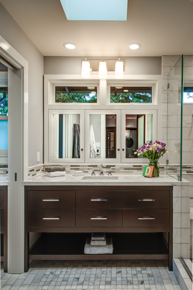 Inspiration for a large classic bathroom in San Francisco with a submerged sink, flat-panel cabinets, dark wood cabinets, white tiles and grey walls.