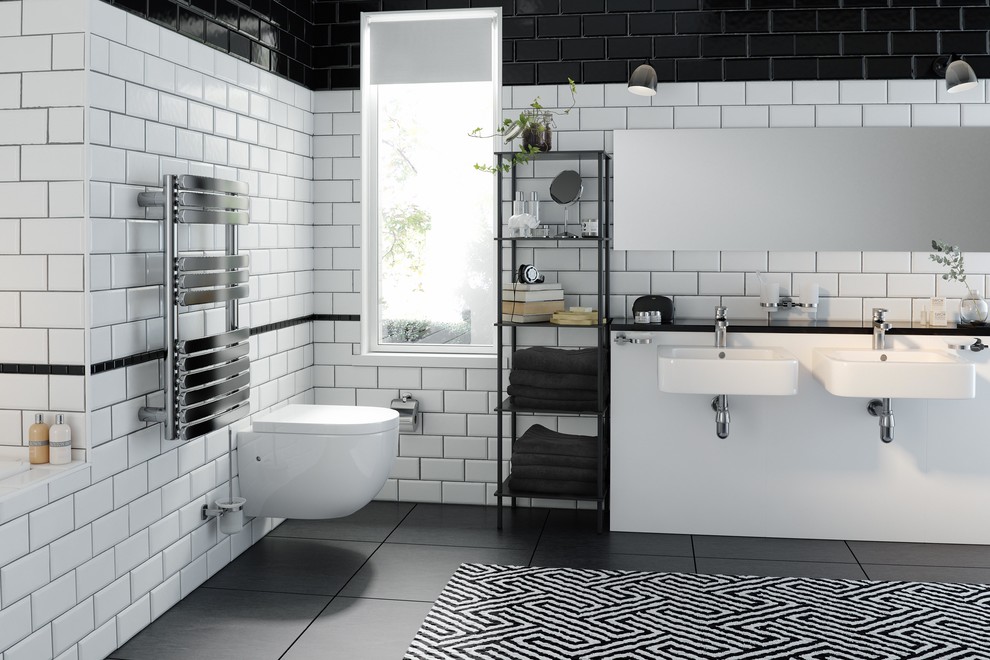 Cette image montre une salle de bain minimaliste de taille moyenne pour enfant avec un carrelage blanc, des carreaux de céramique, un mur multicolore, un sol en ardoise, un lavabo suspendu, un plan de toilette en marbre et un sol gris.