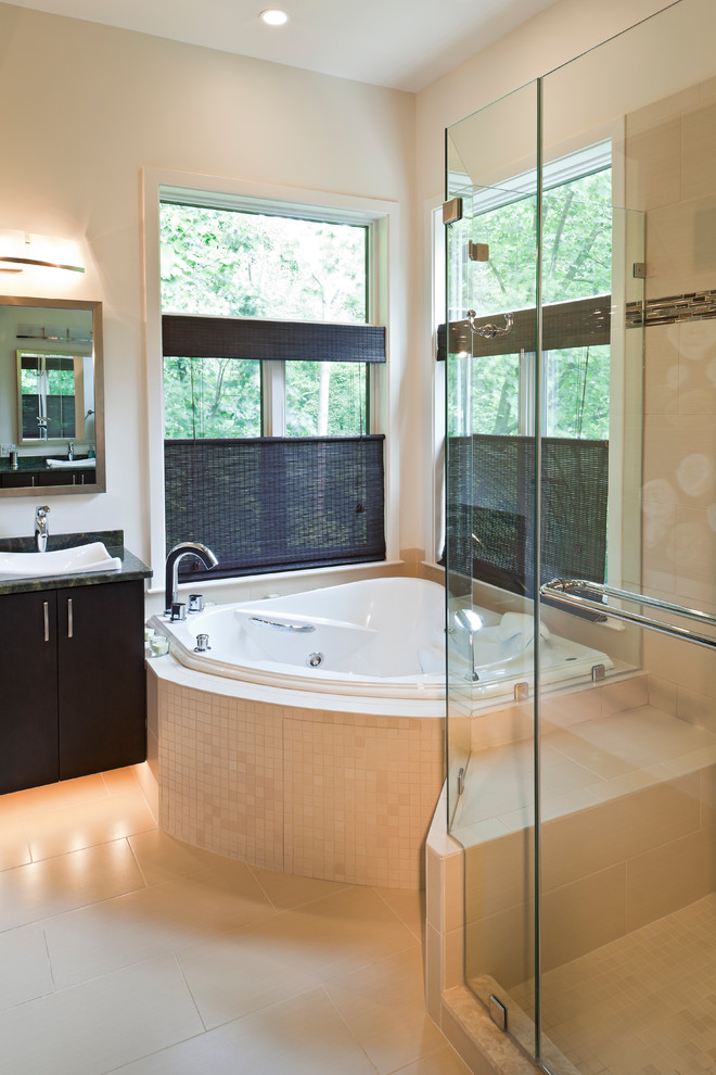 Example of a mid-sized asian master beige tile and porcelain tile porcelain tile bathroom design in Other with flat-panel cabinets, brown cabinets, a two-piece toilet, beige walls, a drop-in sink and granite countertops