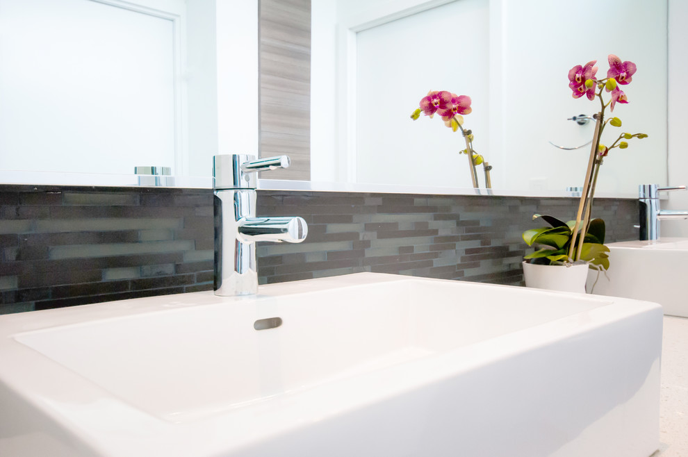 Example of a trendy gray tile and porcelain tile bathroom design in Houston with a vessel sink, shaker cabinets, quartz countertops and a one-piece toilet