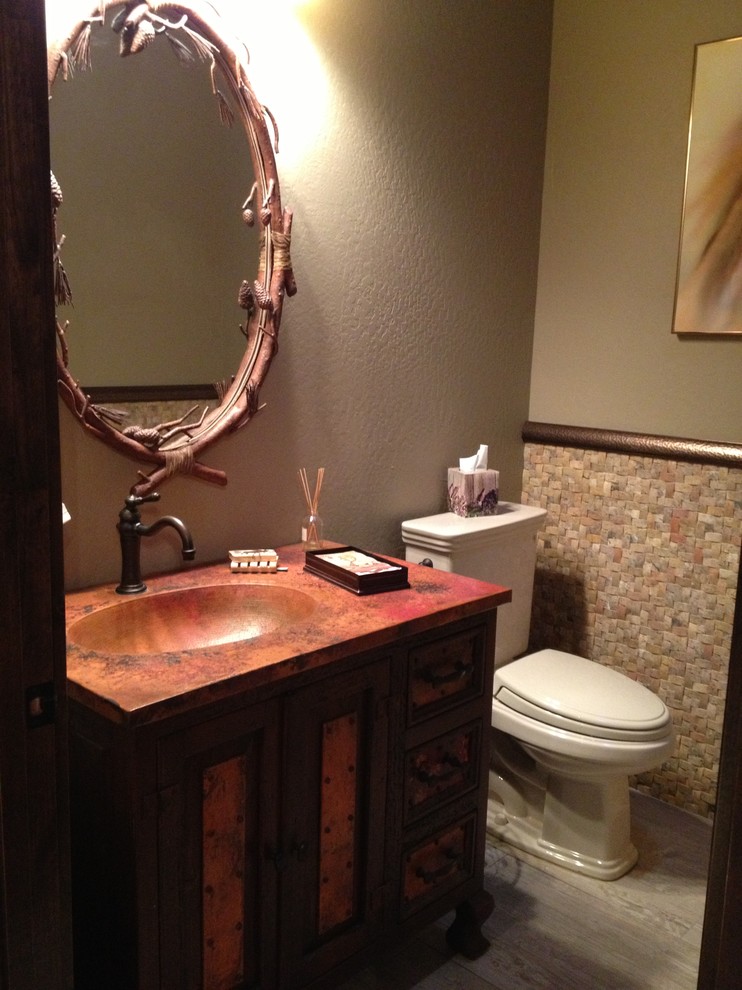 Small 3/4 multicolored tile and stone tile porcelain tile drop-in bathtub photo in Phoenix with dark wood cabinets