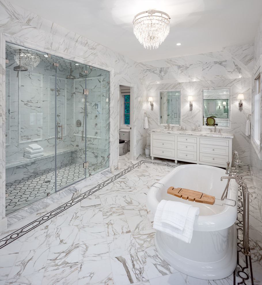 Example of a large transitional master white floor bathroom design in Vancouver with recessed-panel cabinets, white cabinets, a two-piece toilet, white walls, an undermount sink, a hinged shower door and white countertops