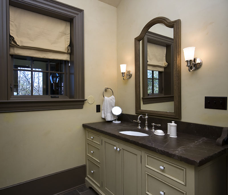 Freestanding bathtub - mid-sized rustic master limestone floor freestanding bathtub idea in Other with furniture-like cabinets, gray cabinets, beige walls, an undermount sink and soapstone countertops