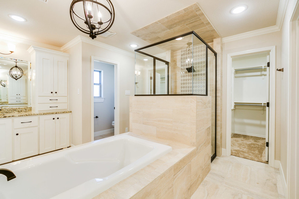 Inspiration for a large traditional ensuite bathroom in Austin with shaker cabinets, white cabinets, a built-in bath, an alcove shower, a one-piece toilet, beige tiles, porcelain tiles, beige walls, porcelain flooring, a submerged sink, granite worktops, beige floors and a hinged door.