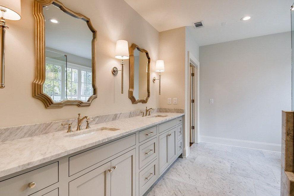 Large traditional ensuite bathroom in Atlanta with shaker cabinets, grey cabinets, a freestanding bath, a corner shower, white tiles, marble tiles, grey walls, marble flooring, a submerged sink, marble worktops, grey floors, a hinged door, white worktops, double sinks and a freestanding vanity unit.