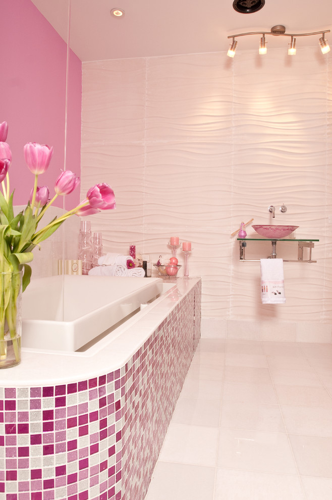 Example of a large trendy kids' mosaic tile and pink tile ceramic tile and white floor bathroom design in New York with pink walls, open cabinets, a one-piece toilet, a wall-mount sink and glass countertops