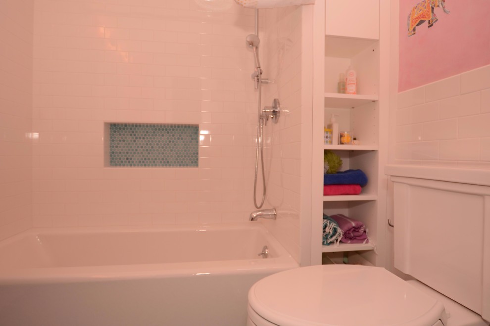 Design ideas for a medium sized shabby-chic style family bathroom in New York with open cabinets, white cabinets, an alcove bath, a shower/bath combination, a two-piece toilet, white tiles, metro tiles, pink walls, mosaic tile flooring, a trough sink, blue floors and a shower curtain.