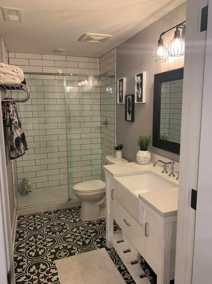 Mid-sized minimalist 3/4 white tile and porcelain tile vinyl floor and gray floor bathroom photo in Denver with furniture-like cabinets, white cabinets, a one-piece toilet, gray walls, an undermount sink, quartzite countertops and white countertops