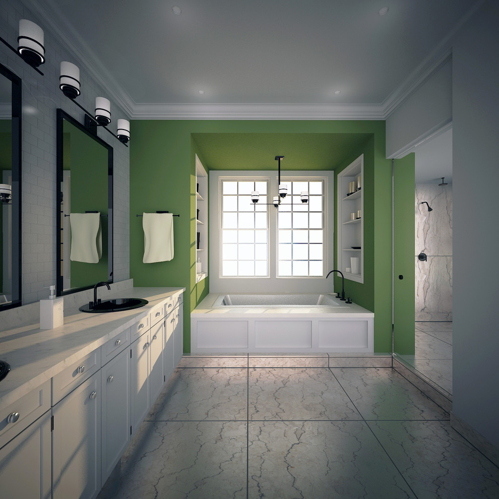他の地域にあるラグジュアリーな広いモダンスタイルのおしゃれなマスターバスルーム (オーバーカウンターシンク、落し込みパネル扉のキャビネット、白いキャビネット、大理石の洗面台、ドロップイン型浴槽、アルコーブ型シャワー、一体型トイレ	、白いタイル、サブウェイタイル、緑の壁、トラバーチンの床) の写真