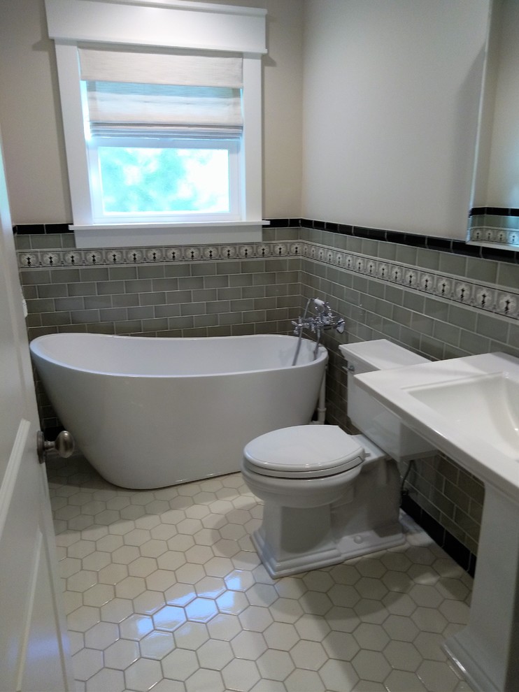 Small arts and crafts 3/4 green tile and ceramic tile ceramic tile and white floor freestanding bathtub photo in Los Angeles with a two-piece toilet, beige walls and a pedestal sink