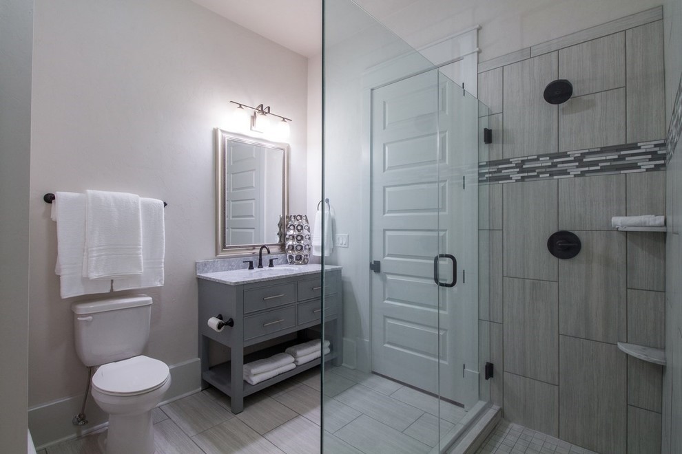 This is an example of a small classic shower room bathroom in Atlanta with flat-panel cabinets, grey cabinets, a corner shower, porcelain tiles, white walls, ceramic flooring, a built-in sink and marble worktops.