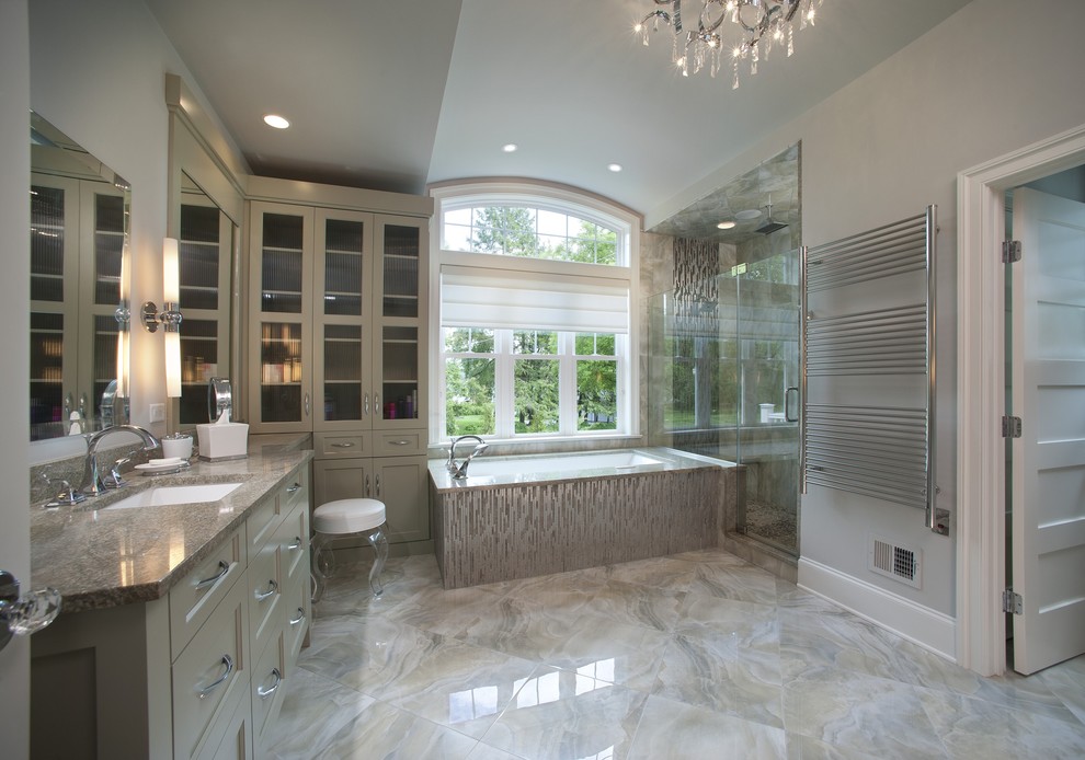 Contemporary bathroom in Philadelphia with a submerged sink, a submerged bath, an alcove shower, grey tiles, recessed-panel cabinets and beige cabinets.