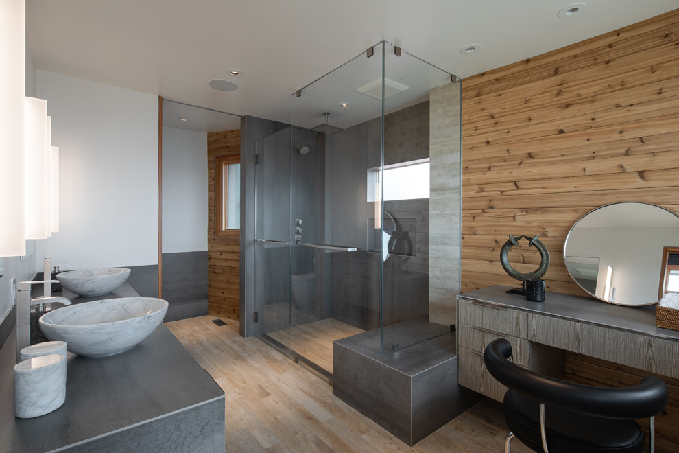 Inspiration for a contemporary ensuite bathroom in Los Angeles with a built-in shower, grey tiles, white walls, a vessel sink, beige floors, a hinged door and grey worktops.