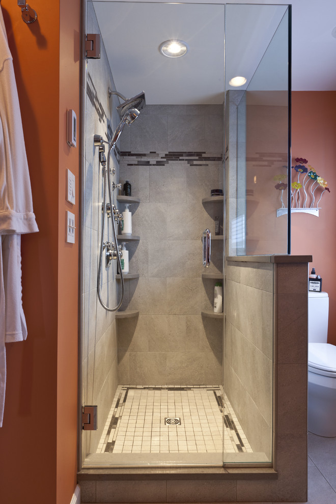 Example of a mid-sized eclectic master gray tile and porcelain tile porcelain tile alcove shower design in Bridgeport with a vessel sink, furniture-like cabinets, dark wood cabinets, wood countertops, a two-piece toilet and orange walls