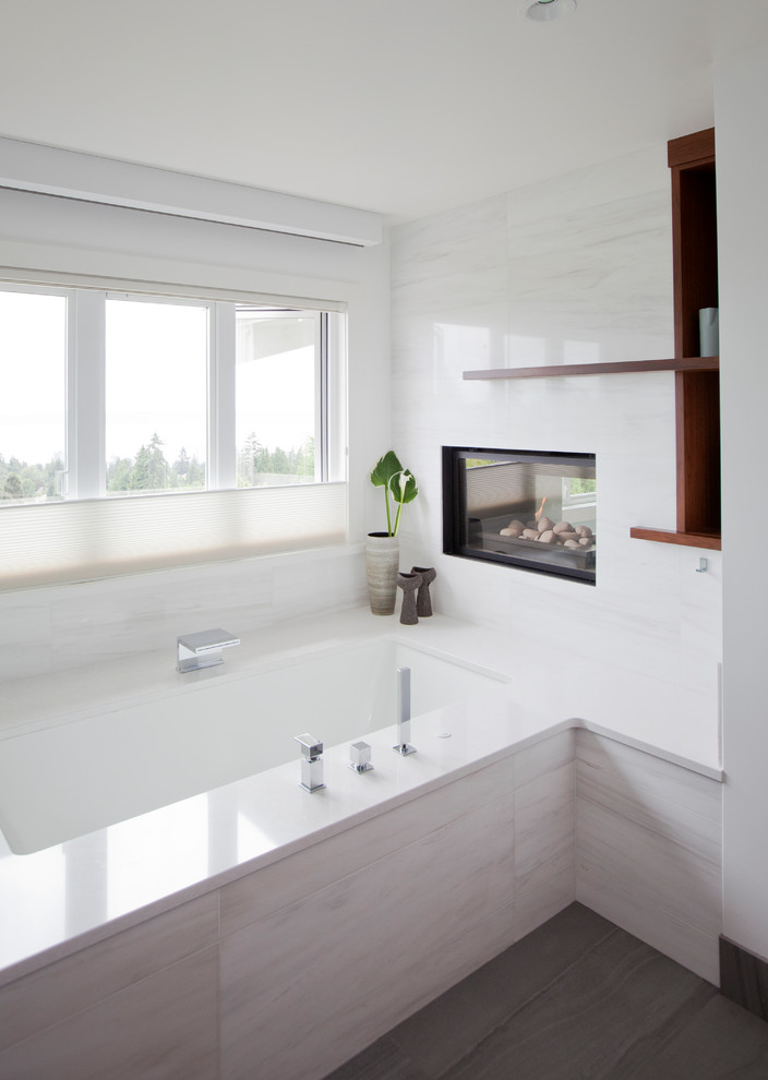 Inspiration for a large contemporary master white tile and porcelain tile porcelain tile and gray floor bathroom remodel in Vancouver with flat-panel cabinets, brown cabinets, white walls, an undermount sink, quartz countertops and a hinged shower door