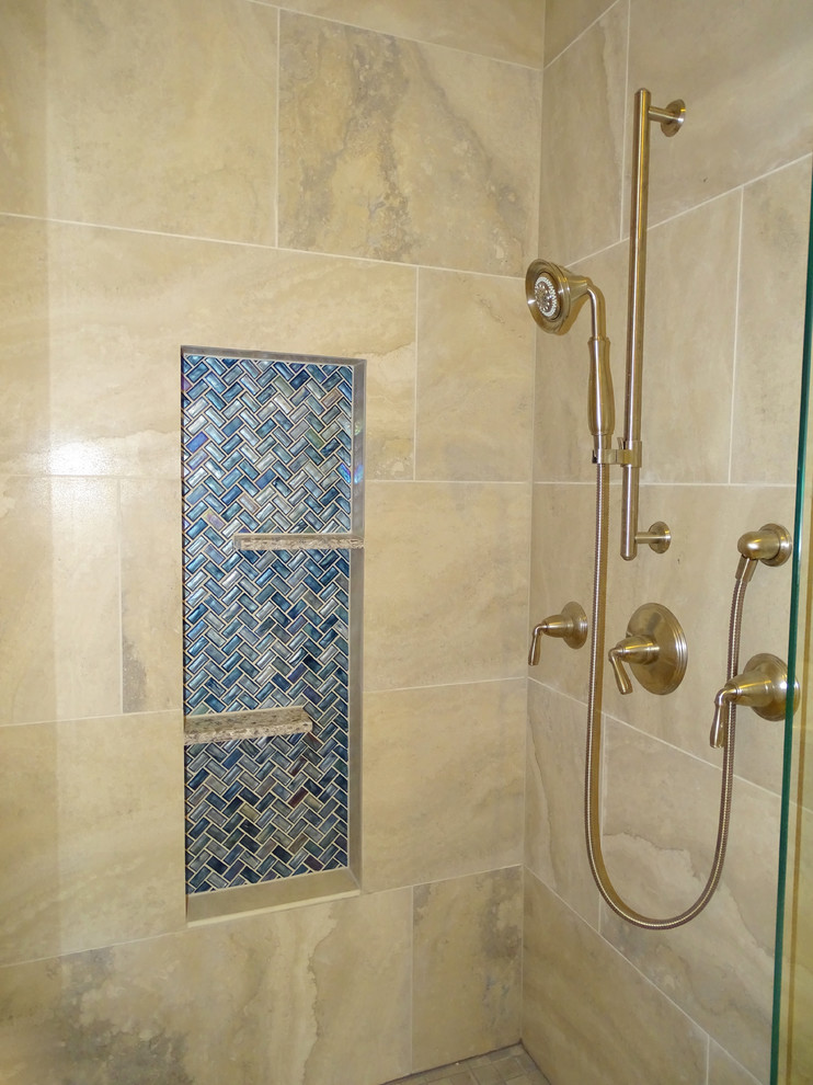 Example of a large transitional master beige tile and ceramic tile ceramic tile bathroom design in Austin with shaker cabinets, dark wood cabinets, blue walls, a drop-in sink and quartz countertops