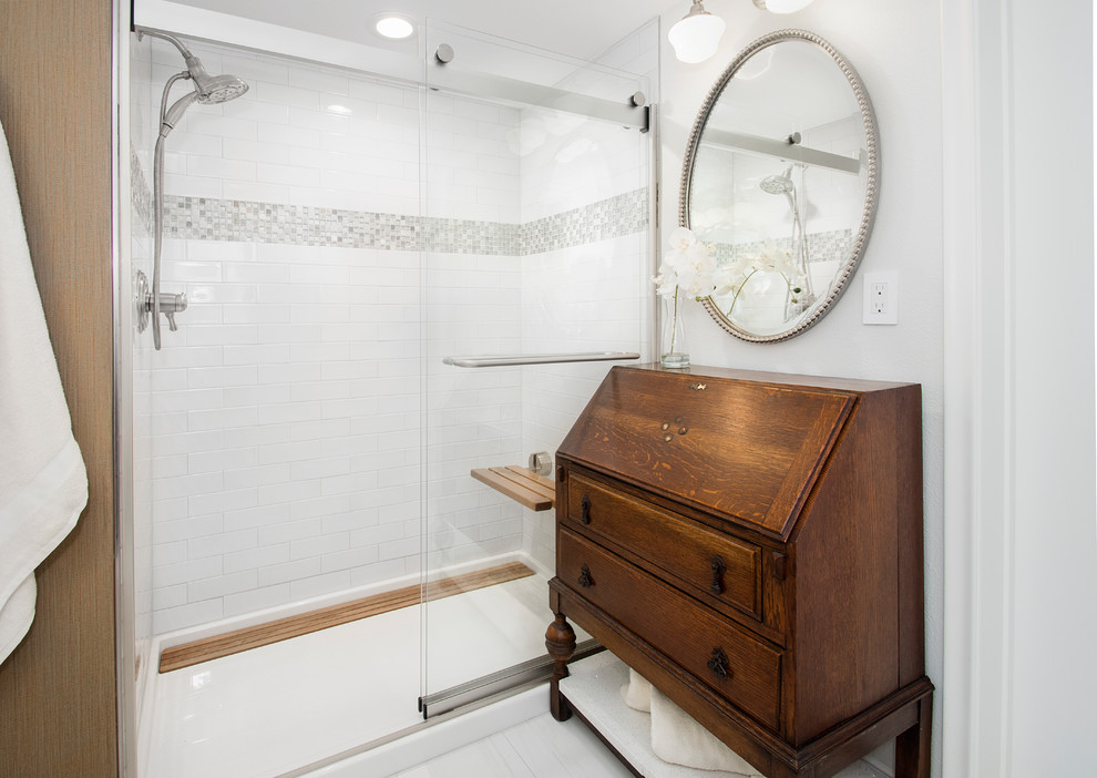 This is an example of a medium sized traditional shower room bathroom in Dallas with flat-panel cabinets, green cabinets, a double shower, a two-piece toilet, white tiles, porcelain tiles, grey walls, porcelain flooring, a submerged sink, white floors and a sliding door.