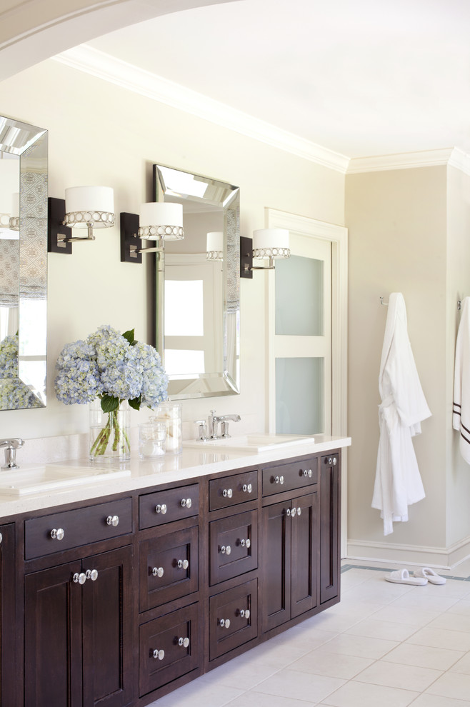 Mid-sized transitional master white tile and ceramic tile alcove shower photo in Little Rock with a drop-in sink, recessed-panel cabinets, dark wood cabinets and beige walls