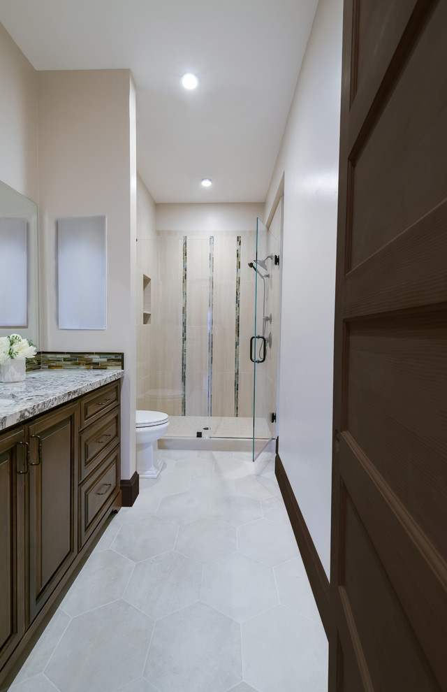 Mid-sized ornate master beige tile and porcelain tile porcelain tile, white floor and single-sink alcove shower photo in San Francisco with raised-panel cabinets, medium tone wood cabinets, a two-piece toilet, blue walls, an undermount sink, quartz countertops, a hinged shower door, white countertops and a built-in vanity