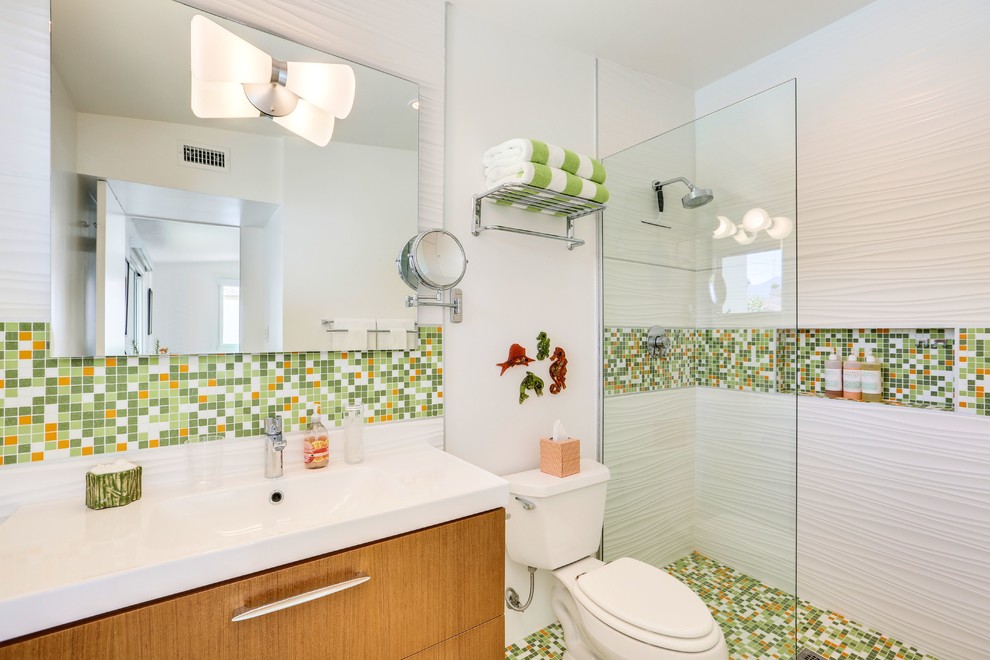 Inspiration for a 1950s 3/4 multicolored tile and mosaic tile mosaic tile floor and multicolored floor bathroom remodel in Los Angeles with flat-panel cabinets, medium tone wood cabinets, a two-piece toilet, white walls and an integrated sink