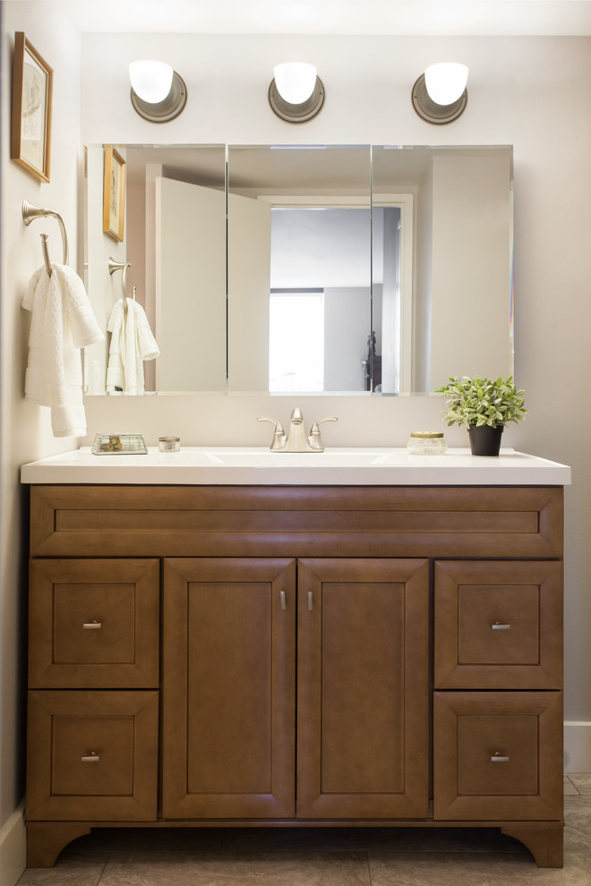 Bathroom - small transitional 3/4 white tile and ceramic tile dark wood floor and beige floor bathroom idea in Other with recessed-panel cabinets, medium tone wood cabinets, a two-piece toilet, beige walls, a wall-mount sink and solid surface countertops