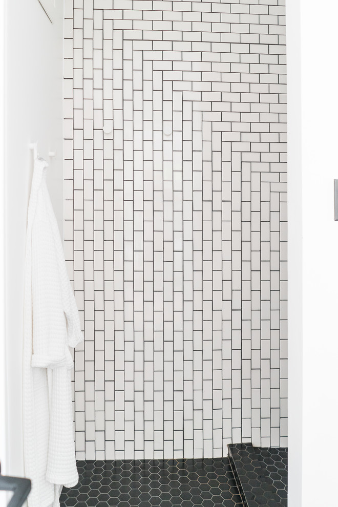 Design ideas for a medium sized modern shower room bathroom in Austin with flat-panel cabinets, white cabinets, an alcove shower, white tiles, metro tiles, white walls, a submerged sink, solid surface worktops and an open shower.