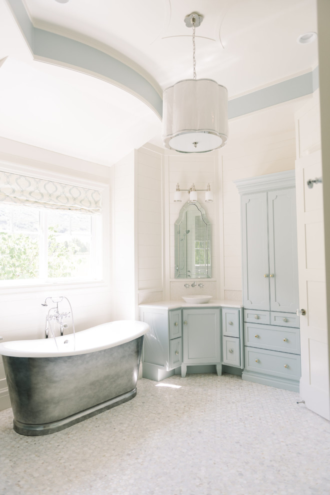 Inspiration for a classic bathroom in Salt Lake City with grey cabinets, a freestanding bath, white walls, a vessel sink and recessed-panel cabinets.