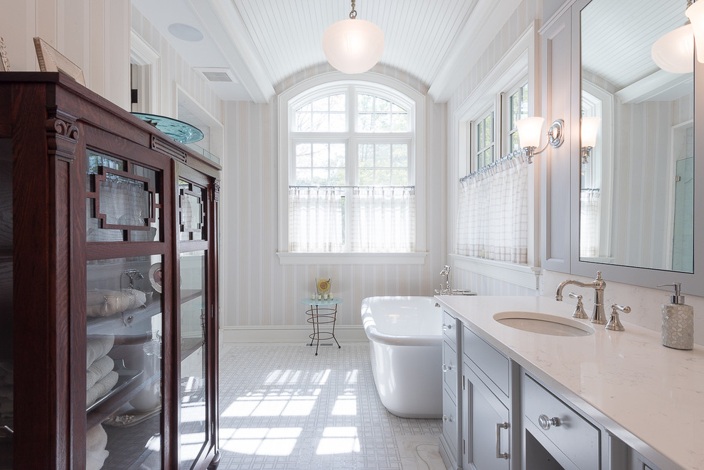 Inspiration for a timeless master freestanding bathtub remodel in Bridgeport with an undermount sink, shaker cabinets, gray cabinets and multicolored walls
