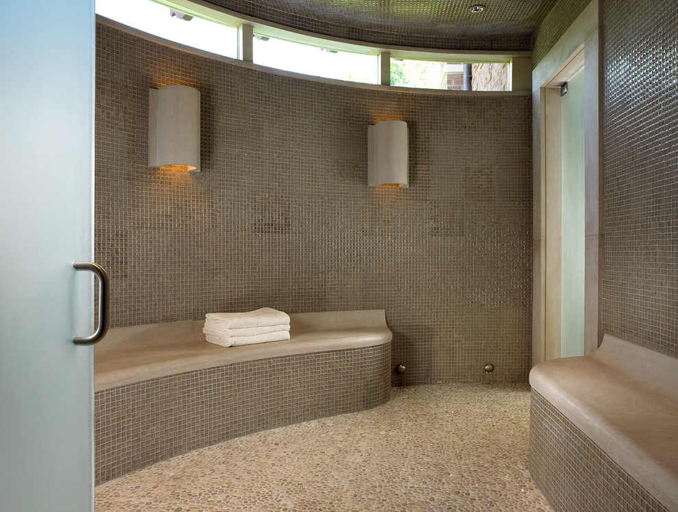This is an example of a contemporary bathroom in Nashville with mosaic tiles, pebble tile flooring and feature lighting.