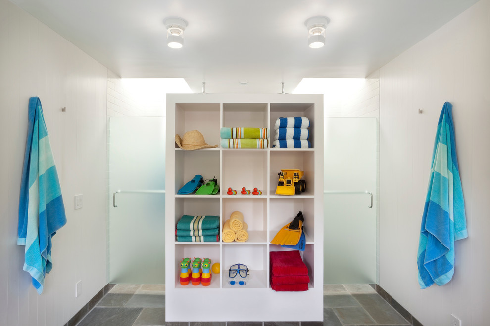 Design ideas for a contemporary bathroom in San Francisco with open cabinets, a built-in shower and grey tiles.